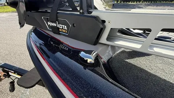 Slide: The Image of Close-up of a boat with Minn Kota Ultrex motor, shiny black hull, and gray deck. - 11