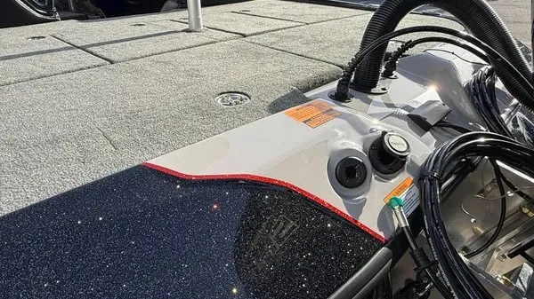 Slide: The Image of Close-up of a Skeeter ZXE20 boat deck with a glossy finish and visible cables. - 7