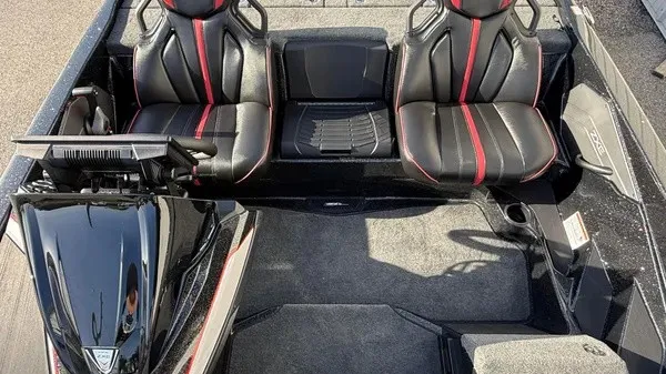 Slide: The Image of The image shows the cockpit of a 2026 Skeeter ZXE20 boat with two black seats. - 17