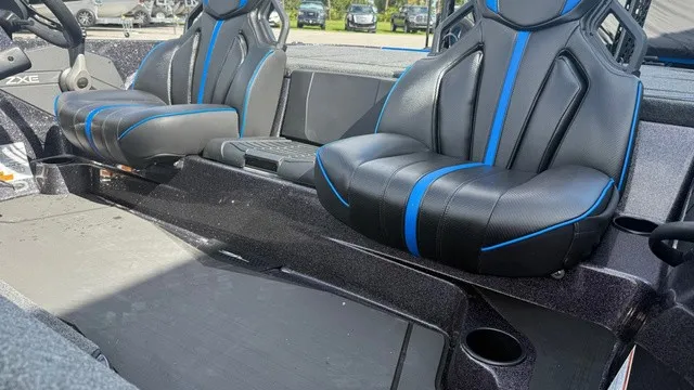 Slide: The Image of The image shows two black seats with blue stripes in a boat. - 16