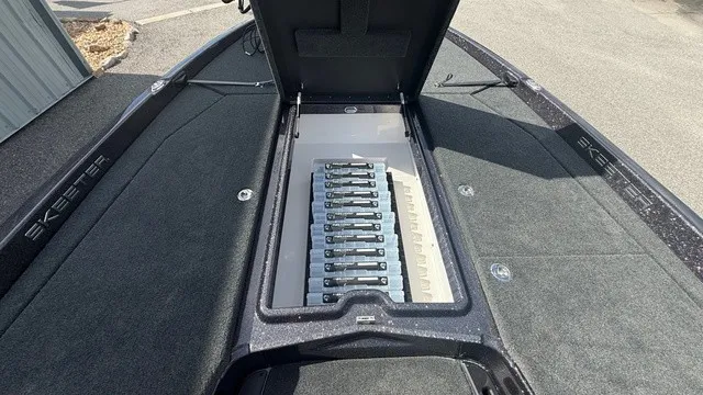 Slide: The Image of The image shows the deck of a 2027 Skeeter ZXE21 boat with an open storage compartment. - 13