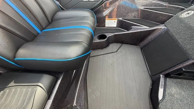 Slide: The Image of The image shows the interior of a 2027 Skeeter ZXE21 with black seats and blue accents. - 11