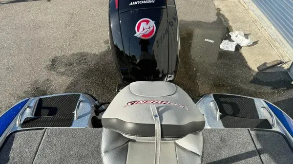Slide: The Image of The image shows the rear of a Phoenix 818 Pro boat with a Mercury outboard motor. - 17