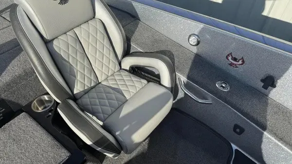 Slide: The Image of A sleek seat with gray and black upholstery in a modern boat. - 18