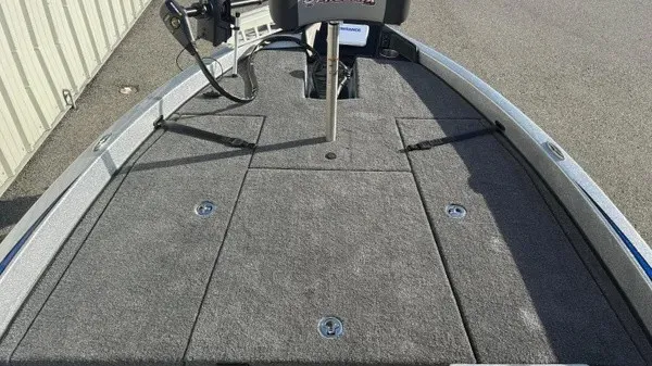 Slide: The Image of The image shows the front deck of a 2027 Phoenix 818 Pro boat with gray carpeting. - 11