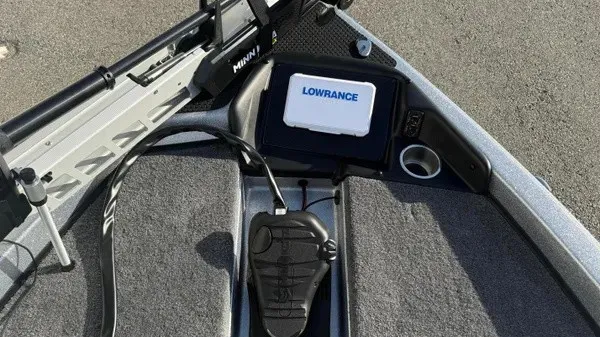 Slide: The Image of The image shows the deck of a Phoenix 818 Pro boat with a Lowrance device. - 12