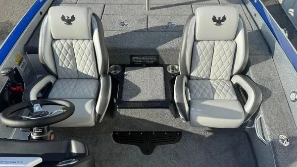 Slide: The Image of The image shows the interior of a Phoenix 818 Pro boat with two cushioned seats. - 14