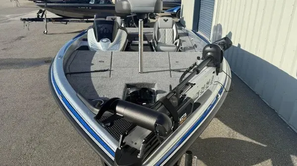 Slide: The Image of A 2027 Phoenix 818 Pro with gray carpeting and a modern helm station. - 9