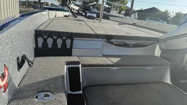 Slide: The Image of The image shows the deck of a 2027 Phoenix 818 Pro boat with gray carpeting. - 20