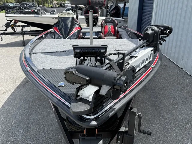 Slide: The Image of The image shows the bow deck of a 2027 Phoenix 920 Elite X II boat with a trolling motor. - 7