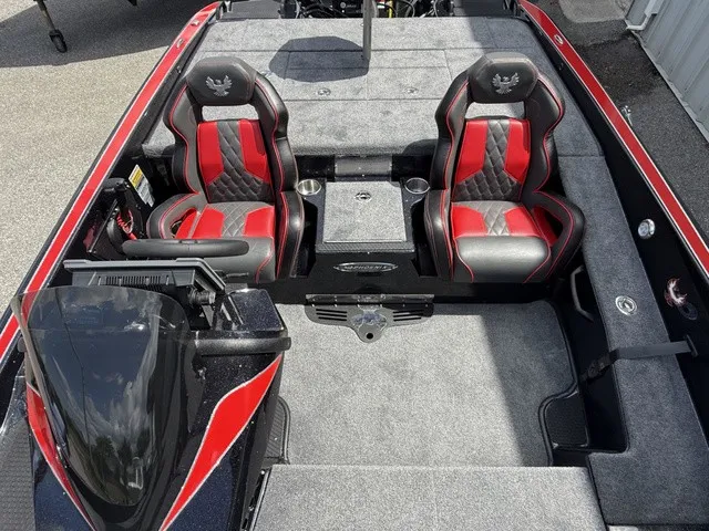 Slide: The Image of The image shows the cockpit of a 2027 Phoenix 920 Elite X II boat with red and black seats. - 14