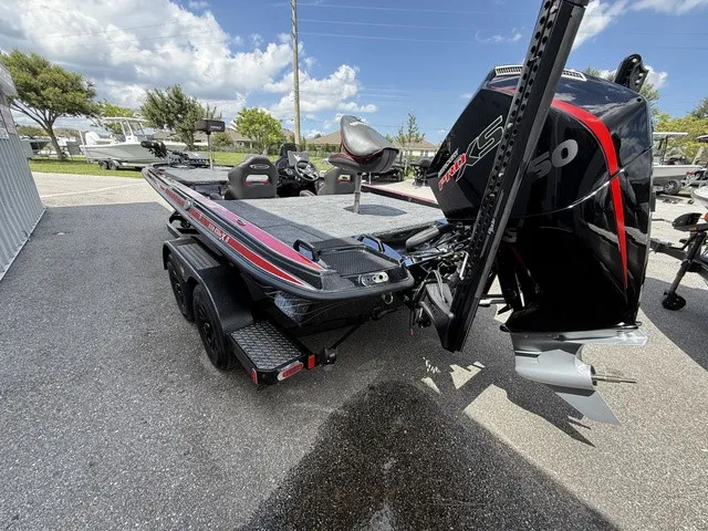 Slide: The Image of The image shows a 2027 Phoenix 920 Elite X II boat on a trailer. - 5