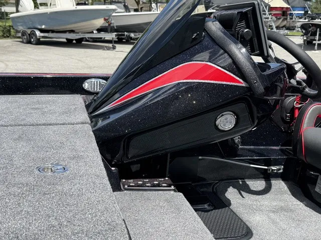 Slide: The Image of The image shows the cockpit of a 2027 Phoenix 920 Elite X II boat with modern controls. - 9