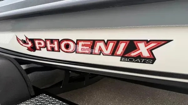 Slide: The Image of Close-up of the Phoenix logo on a boat hull. - 2
