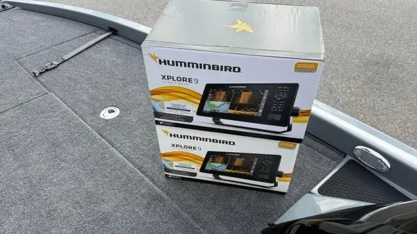 Slide: The Image of Two Humminbird Xplore 9 boxes sit on the deck of a Phoenix 920 Elite X boat. - 11