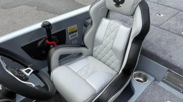 Slide: The Image of The interior of a 2027 Phoenix 920 Elite X features a padded seat with a quilted pattern. - 16