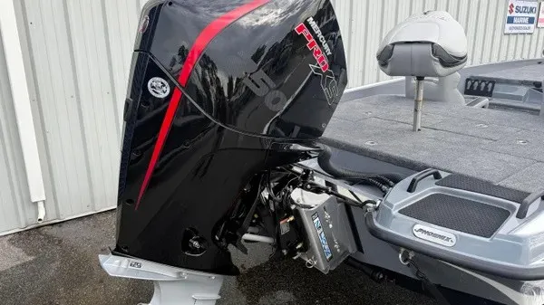 Slide: The Image of A 2027 Phoenix 920 Elite X with a powerful outboard motor and gray deck. - 5