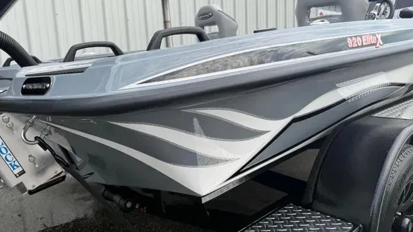 Slide: The Image of A gray boat with stylish white flame accents and the model name "920 Elite X." - 4