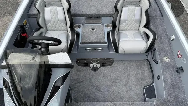 Slide: The Image of The image shows the cockpit of a 2027 Phoenix 920 Elite X boat with two cushioned seats. - 14