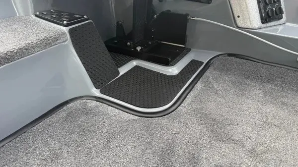 Slide: The Image of The interior of the 2027 Phoenix 920 Elite X features gray carpeting and black rubber mats. - 17