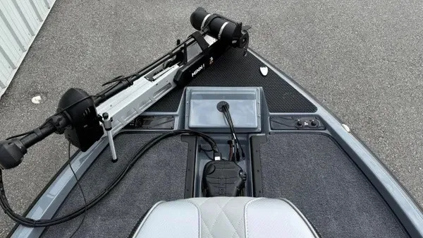 Slide: The Image of The image shows the deck of a Phoenix 920 Elite X boat with a mounted motor. - 13