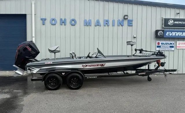 The Image of Phoenix 920 Elite X 2027 in front of a building with boat engines. - 1