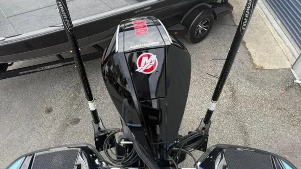 Slide: The Image of A Mercury outboard motor is mounted on a Phoenix 20 XE boat, which is on a trailer. - 13