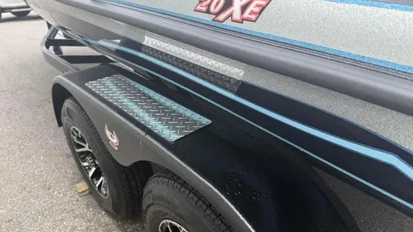 Slide: The Image of Close-up of a boat trailer with "20 XE" branding and blue accents. - 7