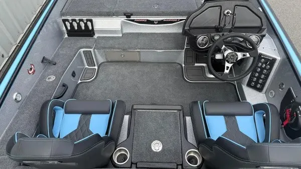 Slide: The Image of Interior of a 2026 Phoenix 20 XE with two blue seats and a modern helm station. - 11