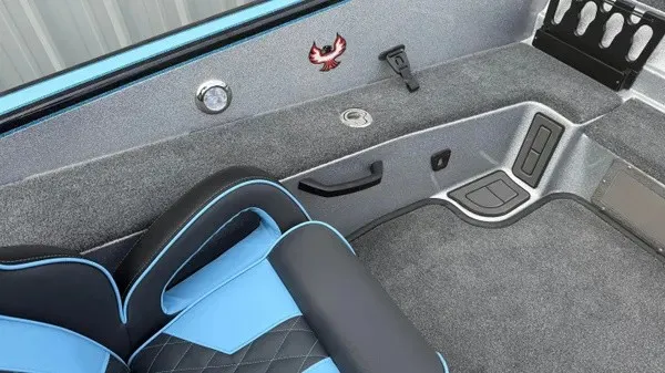 Slide: The Image of The image shows the interior of a 2026 Phoenix 20 XE boat with blue and black seating. - 14