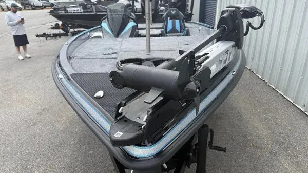 Slide: The Image of A 2026 Phoenix 20 XE boat with a sleek design and powerful motor. - 8