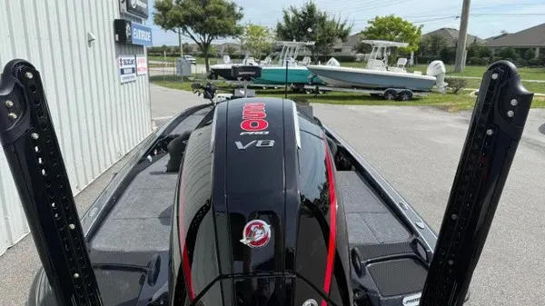 Slide: The Image of The image shows the rear of a Phoenix 921 Elite X boat with a powerful engine. - 22