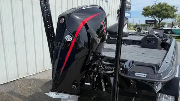 Slide: The Image of The image shows a 2027 Phoenix 921 Elite X boat with a powerful outboard motor. - 5