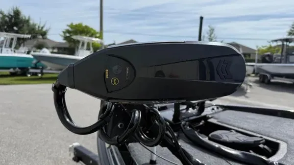Slide: The Image of Close-up of a modern boat motor with a black casing and cables. - 9