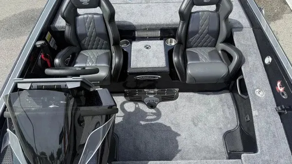 Slide: The Image of The image shows the cockpit of a 2027 Phoenix 921 Elite X boat with two padded seats. - 14
