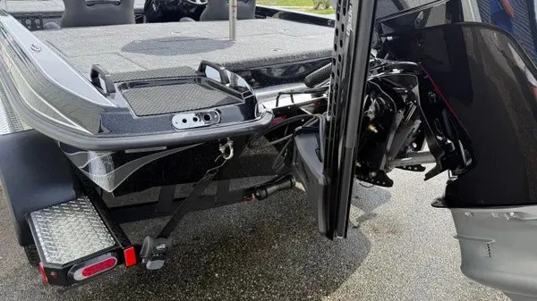 Slide: The Image of The image shows the rear of a 2027 Phoenix 921 Elite X boat with a powerful outboard motor. - 6