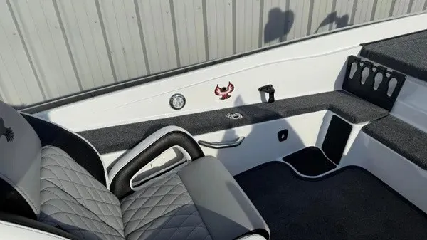 Slide: The Image of Interior view of a Phoenix 721 ZXL boat with gray and black upholstery and a cup holder. - 22