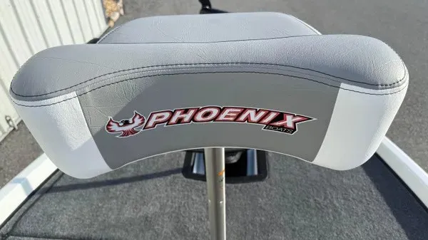Slide: The Image of A gray seat with the Phoenix logo on a boat. - 14