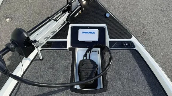 Slide: The Image of The image shows the deck of a Phoenix 721 ZXL boat with a Lowrance fish finder. - 13