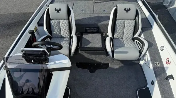 Slide: The Image of The image shows the cockpit of a Phoenix 721 ZXL boat with two cushioned seats and a helm. - 15