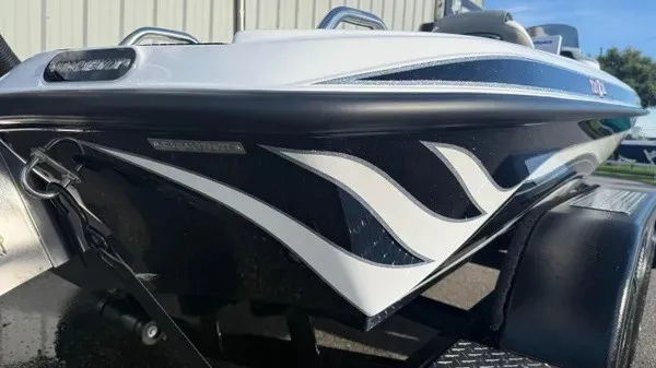 Slide: The Image of The image shows the bow of a Phoenix 721 ZXL boat with stylish graphics. - 4
