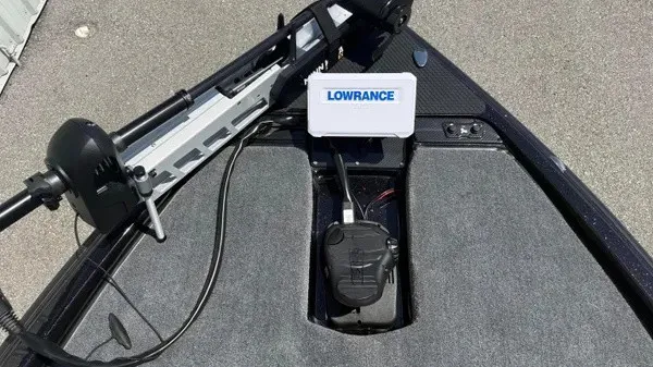 Slide: The Image of The image shows the deck of a Phoenix 919 ZXL boat with a Lowrance device. - 16