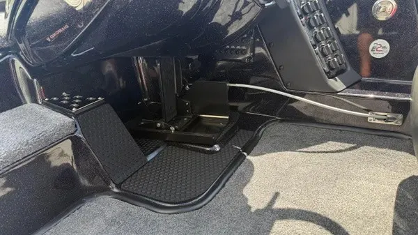 Slide: The Image of Interior view of a 2027 Phoenix 919 ZXL with pedals and carpeted flooring. - 21