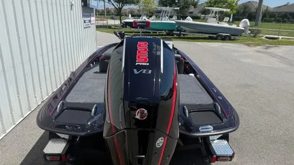 Slide: The Image of A Phoenix 919 ZXL boat with a powerful V8 engine, parked in a sunny outdoor area. - 7