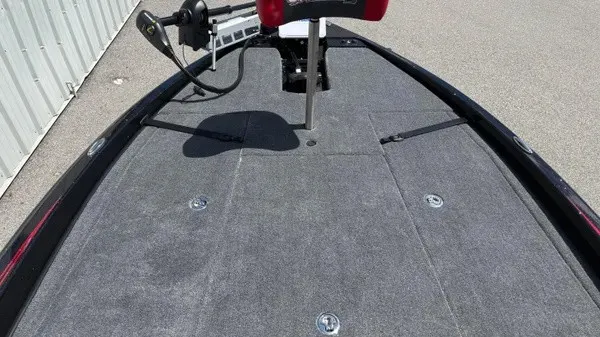 Slide: The Image of The image shows the deck of a 2027 Phoenix 919 ZXL boat with gray carpeting. - 14