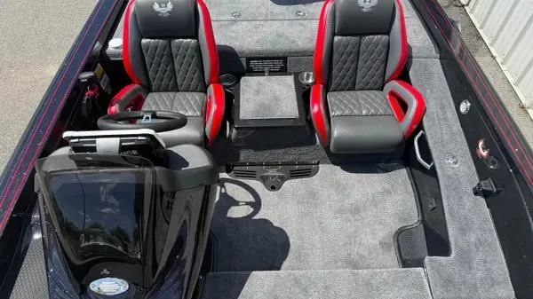Slide: The Image of The image shows the cockpit of a Phoenix 919 ZXL boat with two padded seats. - 17