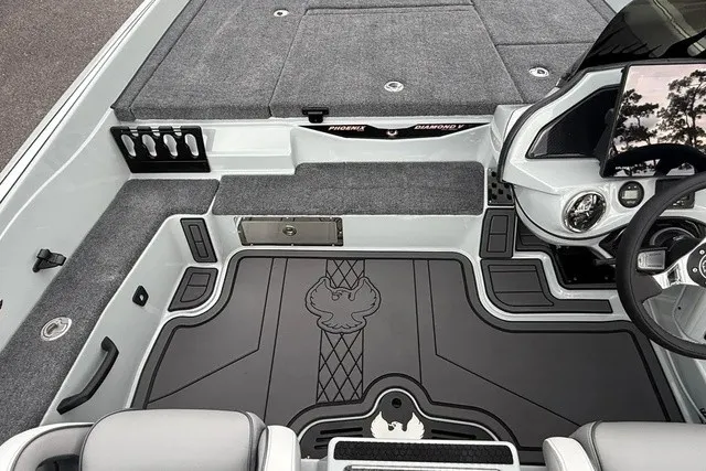 Slide: The Image of Interior of a 2027 Phoenix 921 Elite X II with gray carpeting and modern controls. - 18
