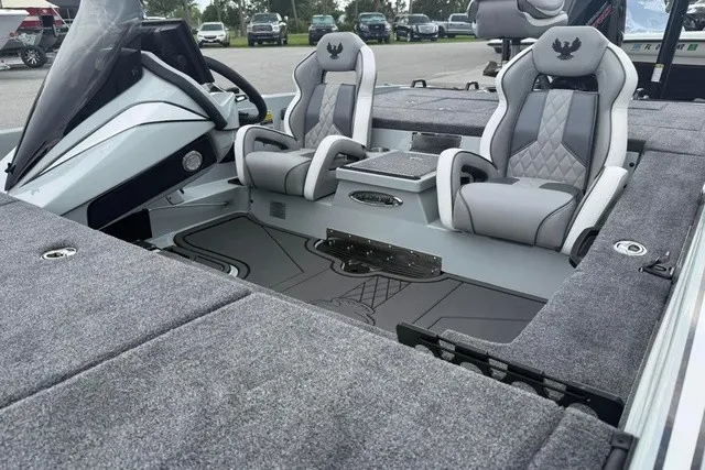 Slide: The Image of The image shows the cockpit of a 2027 Phoenix 921 Elite X II with two cushioned seats. - 22