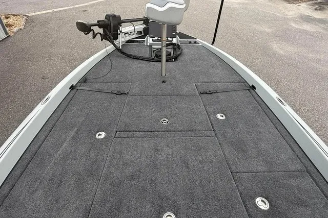 Slide: The Image of The image shows the deck of a 2027 Phoenix 921 Elite X II boat with gray carpeting. - 20