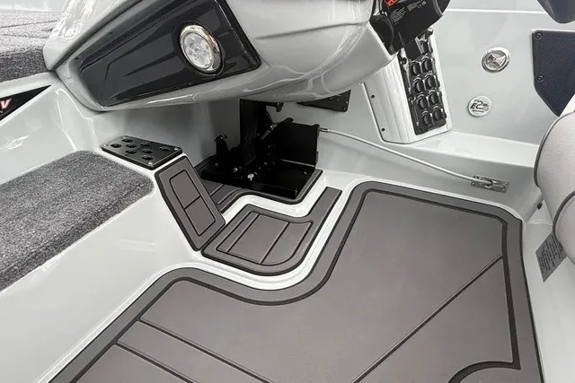 Slide: The Image of The image shows the cockpit of a 2027 Phoenix 921 Elite X II boat with modern controls. - 15